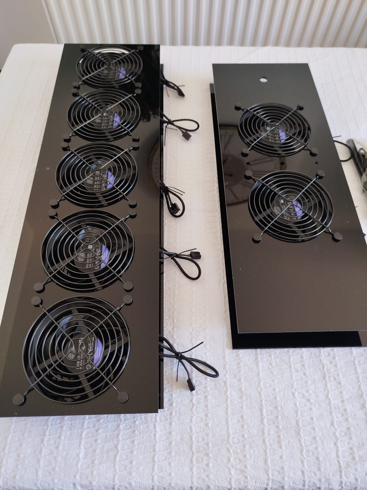 Luggable pre-assembly service — fans fitted to the black acrylic fan panel, correct airflow orientation