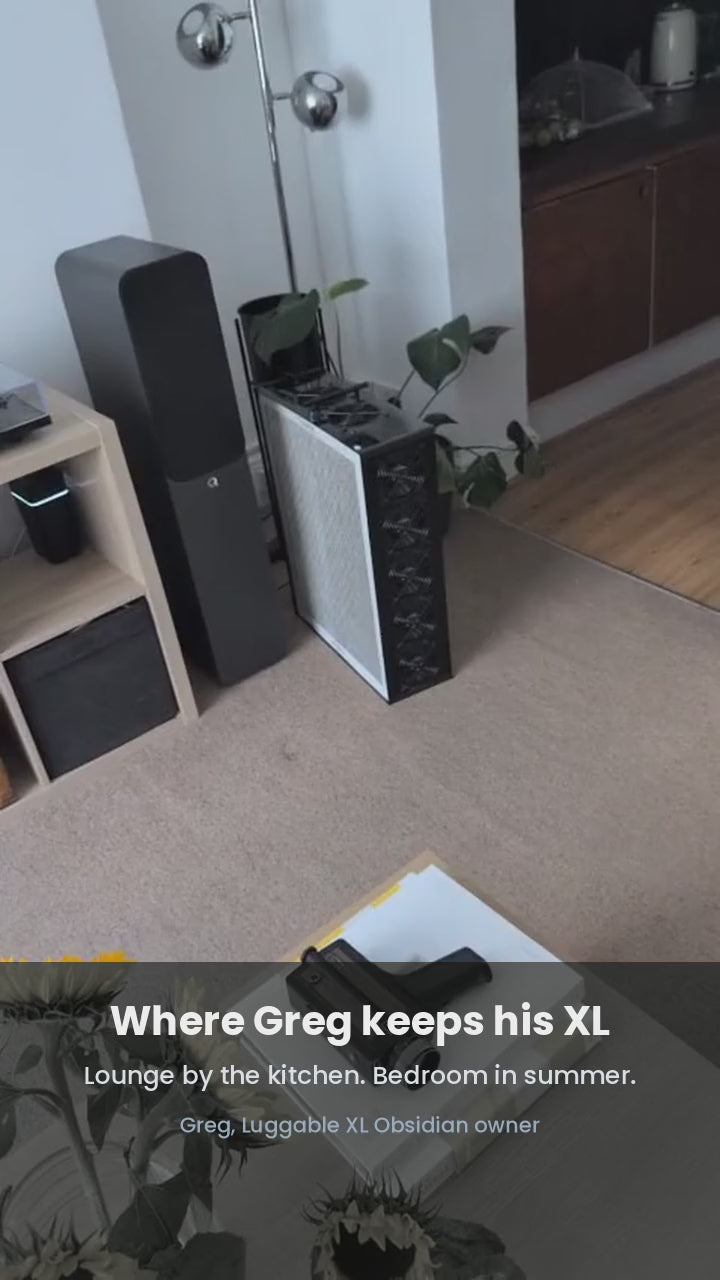 Greg, a Luggable XL Obsidian owner, shows where he keeps it — lounge by the kitchen, bedroom in summer. Captioned video.